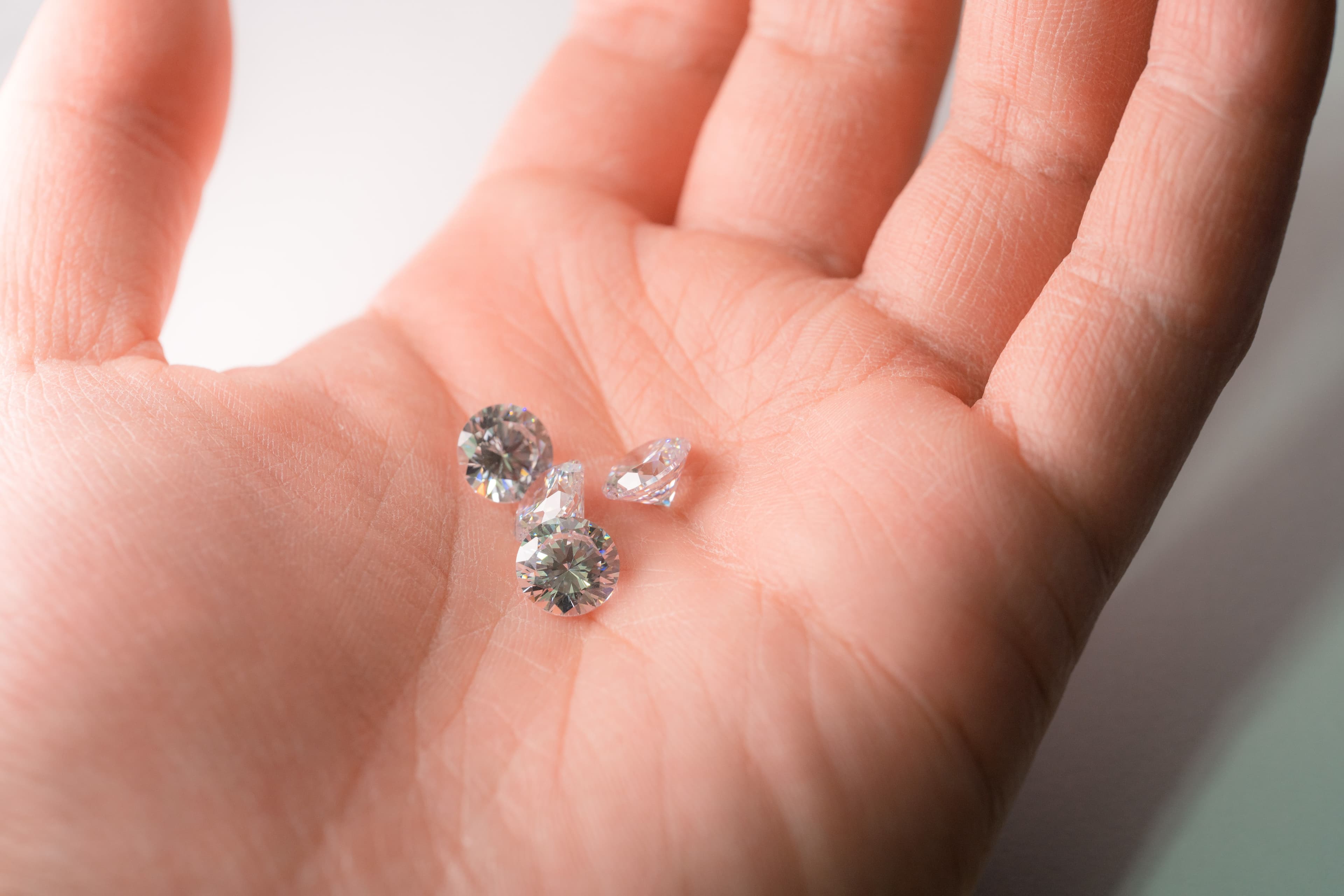 Loose diamonds held in an open palm